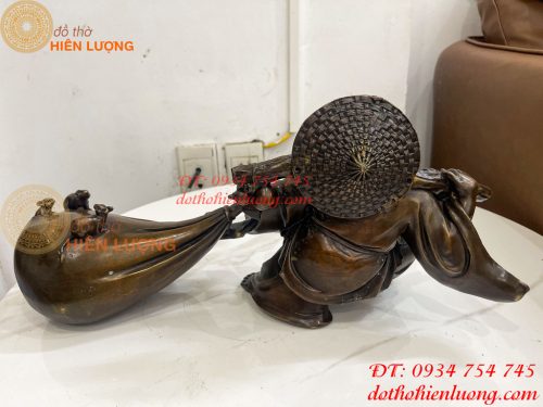 Tượng Di Lặc Kéo Bao Tài Lộc Bằng Đồng Dài 42cm