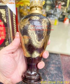 Đèn dầu bằng đồng thổi từ vỏ cát tút chạm rồng phượng