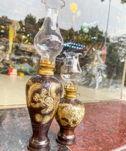 Đèn dầu bằng đồng thổi từ vỏ cát tút chạm rồng phượng